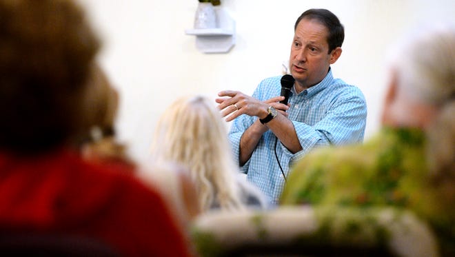 Florida Senate President Joe Negron speaks to a room of community members in a pop-up event at Ground Floor Farm in Stuart on Monday, June 5, 2017. The main topic of discussion for the night was the passage of the plan to reduce Lake Okeechobee discharges, known as Senate Bill 10. "The bill absolutely establishes about 100 billion gallons of storage south of Lake Okeechobee; it instructs the water management district on a very accelerated schedule to start identifying the footprint that we want," Negron said. "And, most importantly, the entire project is completely funded. Nothing else has to happen; no bill has to pass; no budget has to pass. The $800 million of the state commitment to this project is bonded, it's fully funded, and the bill has been signed into law by the governor."