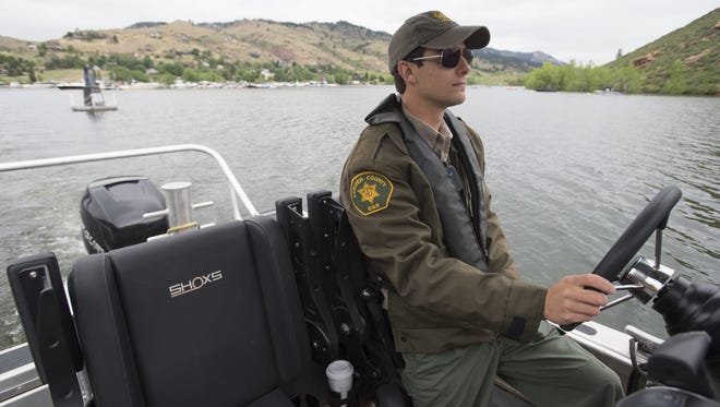 Ranger Trey Reilly sets off from Inlet Bay Marina to patrol Horsetooth Reservoir on Friday, June 23, 2017. Reilly patrols the 6-mile long body of water most weekends looking for boating violations and safety hazards.