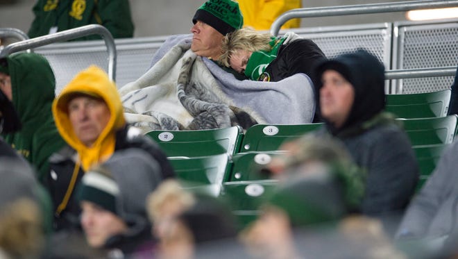 CSU fans bundle up in the stands as the Rams take on Nevada at CSU Stadium on Saturday, October 14, 2017. 
