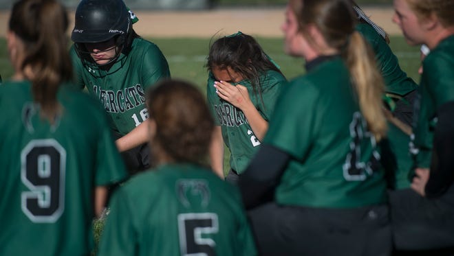 The Fossil Ridge High School softball team reacts to a 9-3 loss to Legend in the CHSAA 5A State Championship game on Saturday, October 21, 2017. 