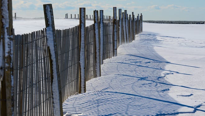 Snow covers the beach in Ocean City, Md. on Friday, Jan. 5, 2018.