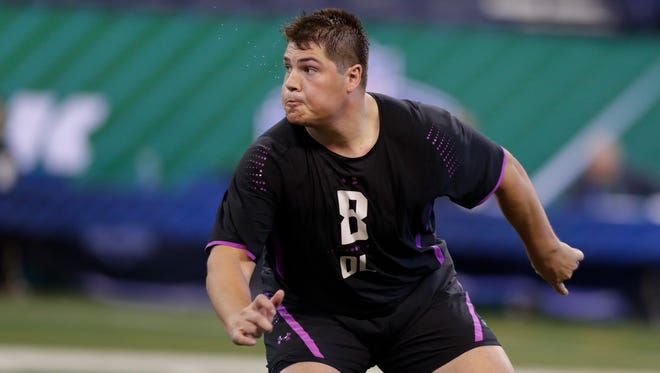 Nevada offensive lineman Austin Corbett runs a drill at the NFL football scouting combine in Indianapolis on Friday.