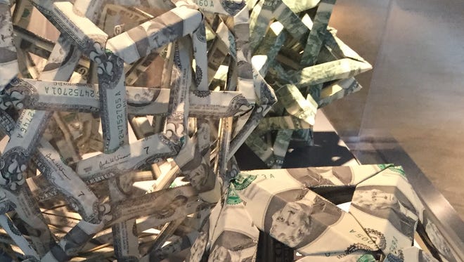 Money troubles can tie you up in knots. Artwork made of money at the Money Museum at the Federal Reserve of Chicago.