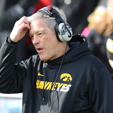 Iowa Hawkeyes football coach Kirk Ferentz watches 