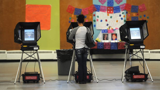 A voters cast a ballot at Hug High School in Reno on Nov. 8, 2016.
