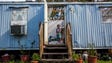Maria Romero, 6, stands in the doorway of her home