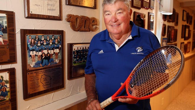Brookfield Central tennis coach Dave Steinbach stands by a wall of memorabilia and accolades in his basement in this 2015 photo.