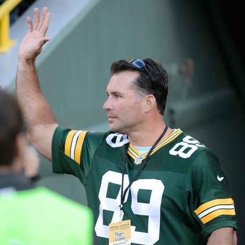Mark Chmura waves to the crowd as he is introduced
