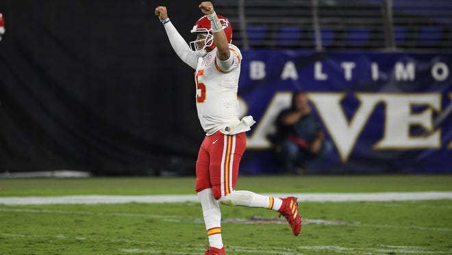 Kansas City Chiefs quarterback Patrick Mahomes celebrates his touchdown pass to offensive tackle Eric Fisher during the second half Monday against the Baltimore Ravens in Baltimore.