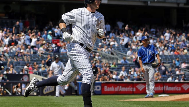 Yankees second baseman Stephen Drew runs up the first baseline after hitting a three-run home run off of Royals starting pitcher Jeremy Guthrie in the second inning.