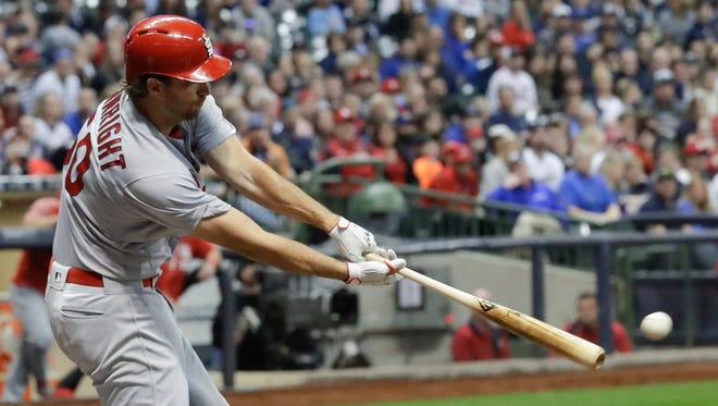 Cardinals pitcher Adam Wainwright hits a two-run single in the fourth inning Friday night at Miller Park.