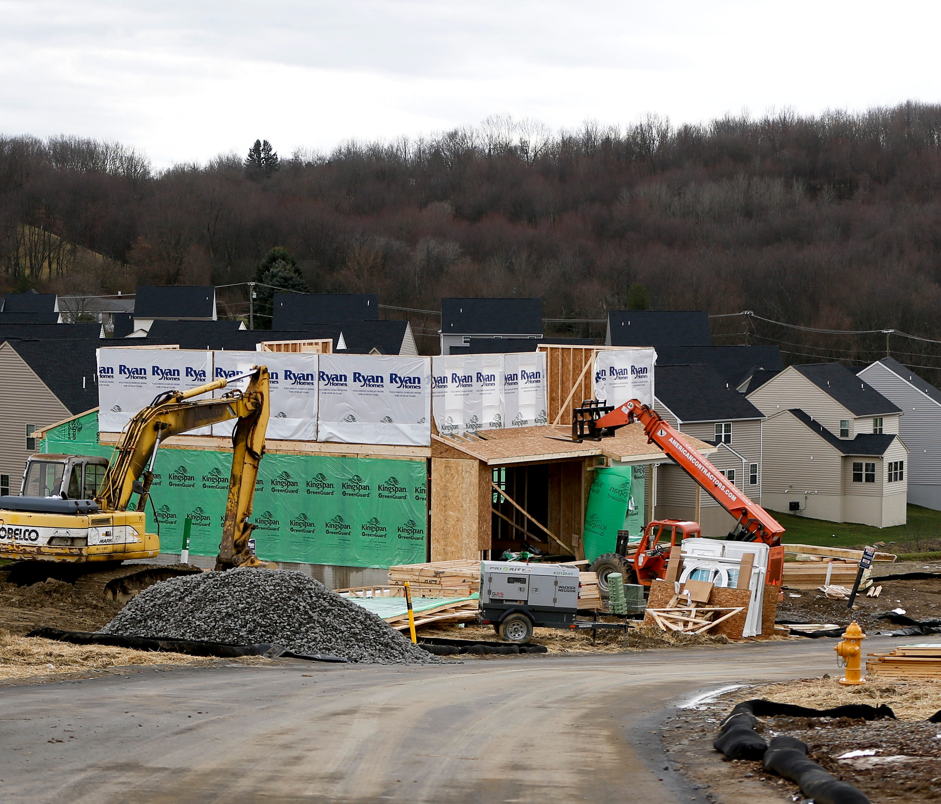 In this March 1, 2017, photo new home construction is underway in a housing plan in Zelienople, Pa. On Friday, Feb. 16, 2018, the Commerce Department reports on U.S. home construction in January. (AP Photo/Keith Srakocic)