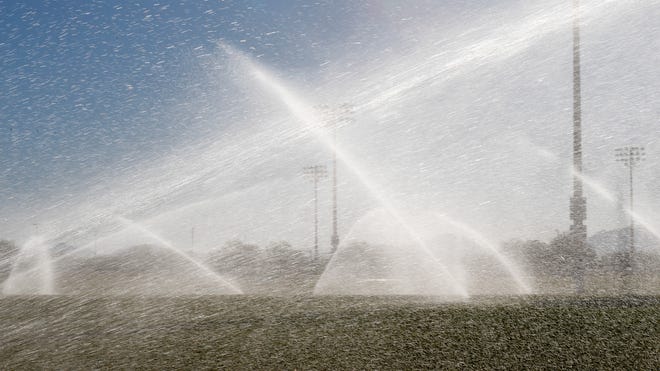 The "SMART" irrigation system runs, June 19, 2014, during a demonstration at the Reach 11 Sports Complex in Phoenix.