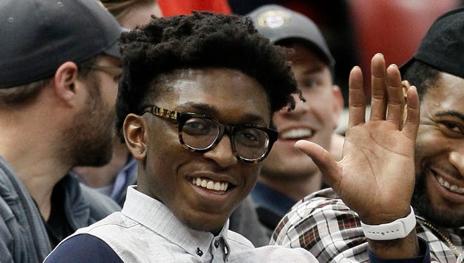 Detroit Pistons rookie Stanley Johnson waves to fans during a college basketball game between Wright State and Oakland in the Horizon League tournament Monday, March 7, 2016, in Detroit.