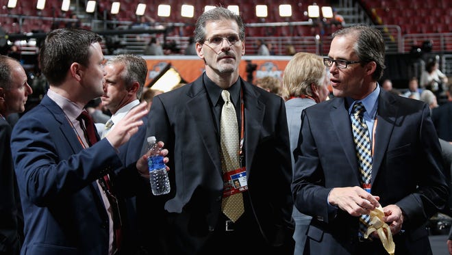 General manager Ron Hextall, left, and his team traveled to Nashville too early, according to the collective bargaining agreement.