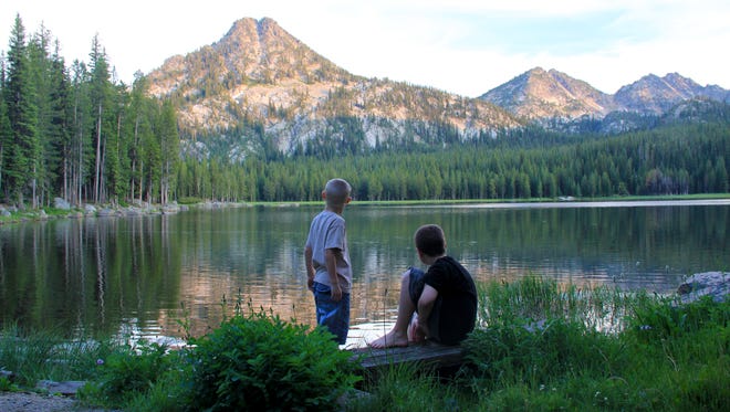 Rylan and Noah Peters look out at sunset on Anthony Lake in the Elkhorn Mountains of Eastern Oregon.