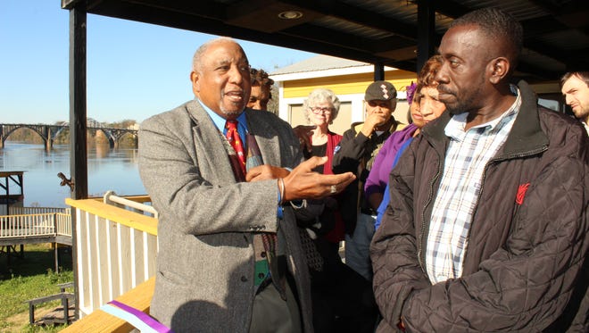 Civil rights icon Bernard Lafayette, left, introduces Melvin Barnes Sr. at the official opening of a Selma anti-violence facility located near the Edmund Pettus Bridge.
