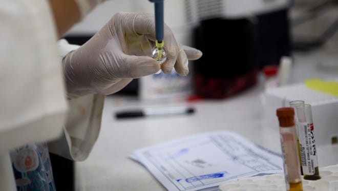 A blood samples from pregnant women are analyzed for the presence of the Zika virus, at Guatemalan Social Security maternity hospital in Guatemala City. Two more Delawareans test positive for Zika.
