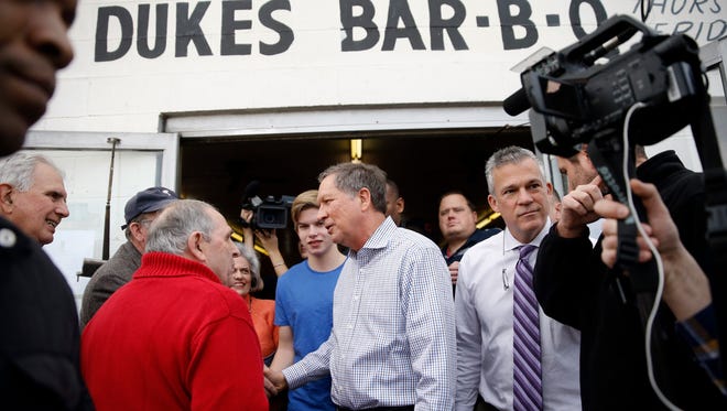 Coming off a strong finish in New Hampshire, Republican presidential candidate, Ohio Gov. John Kasich meets with attendees at a Bar-B-Q restaurant during a campaign stop, Friday, Feb. 12, 2016, in Orangeburg, S.C. in prepration for that state's primary. (AP Photo/Matt Rourke)