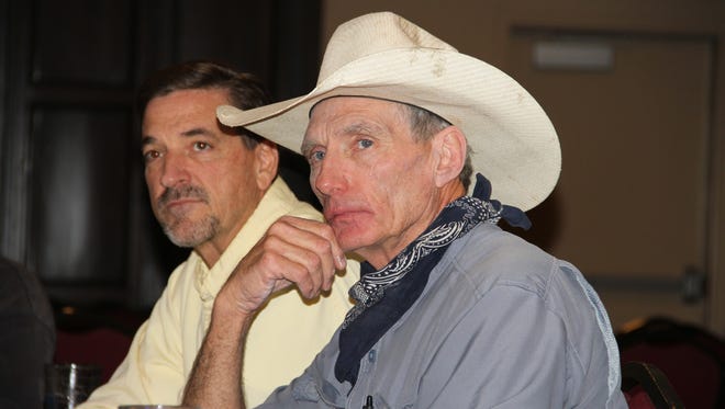 Tim Turri (left) and another local sportsman discuss public lands issues at a New Mexico Wildlife Federation meeting Tuesday evening.