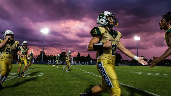 St. John Neumann players leave the field after allowing a touchdown by Community School of Naples in the first quarter in Golden Gate on Friday, Sept. 30, 2016. Neumann and Community School are part of the Big Six football conference formed to ease scheduling concerns after the FHSAA eliminated districts in its lower classifications.
