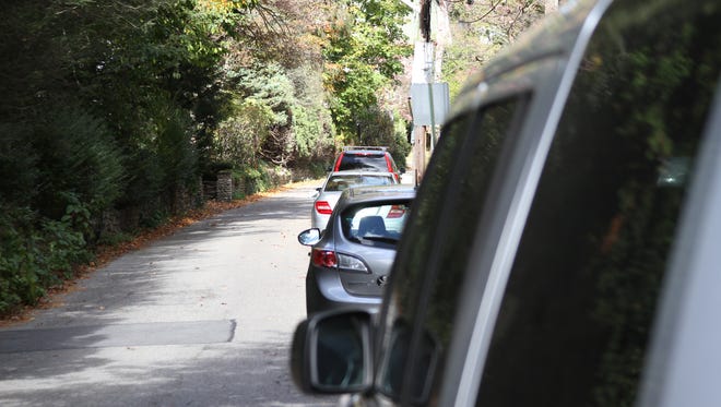 A line of cars on Lynwood Road in Edgemont on Tuesday. The town of Greenburgh is pushing to limit street parking to just residents on the road, and three others near train stations.