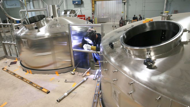 David Dieter welds a stainless steel 30 barrel brewhouse under construction at W.M. Sprinkman Corp.'s new Waukesha facility at 404 Pilot Court, where they are building equipment for the brewing industry.