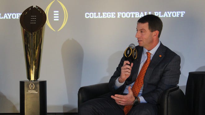 Clemson coach Dabo Swinney answers a question during the College Football Playoff coaches' press conference in Atlanta.