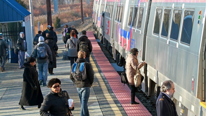Passengers board a northbound SEPTA train at the Claymont train stop in 2015.