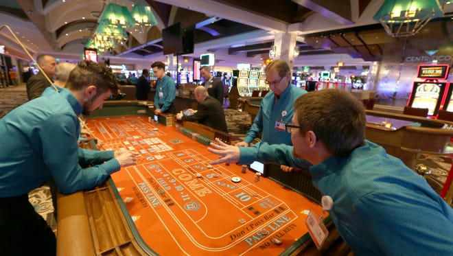 Dealers go through training at one of the gaming tables.
