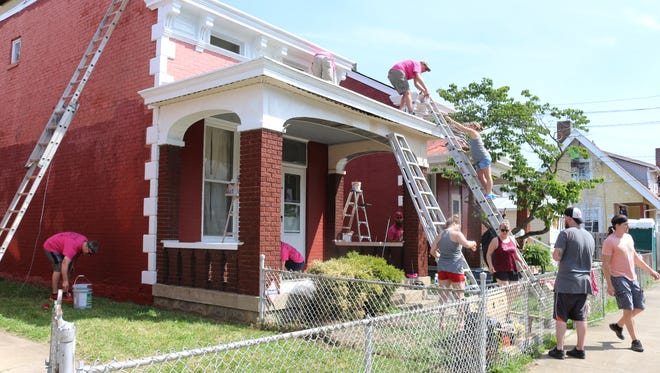 It takes a lot of ladders to paint 30 houses in one day. Volunteers spread throughout Dayton and Bellevue, Kentucky, for Paint the Town 2017.
