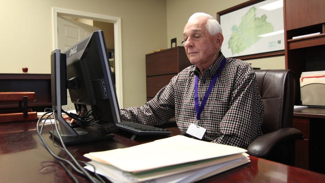 Interim Superintendent Jim Causby will work through the summer at his desk inside the school's central office.