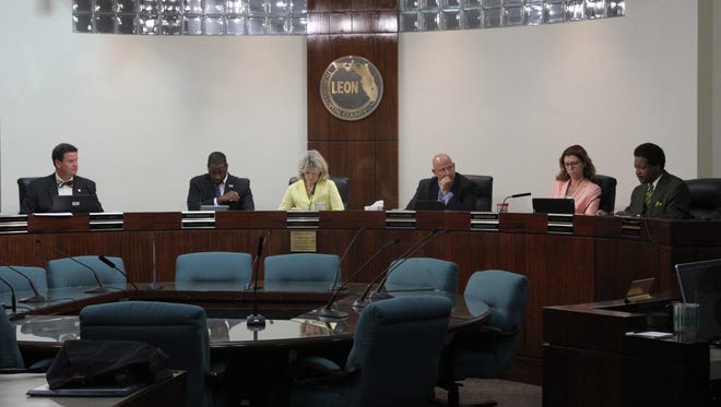 County Commissioners John Dailey, Nick Maddox, Mary Ann Lindley, Jimbo Jackson, Kristin Dozier and Bill Proctor listen to public comment at a meeting on Sept. 20.