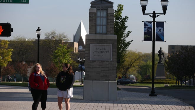 Students walk across the campus at Xavier University, a private Jesuit Catholic university in Cincinnati, Ohio.