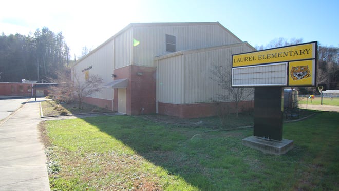 Concerns over costs associated with transforming the Laurel Elementary School building into a community center have slowed a community nonprofit's drive to acquire the site from Madison County.