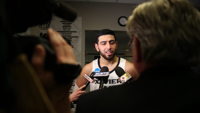 Xavier Musketeers forward Kerem Kanter (11) talks to the media after the game.