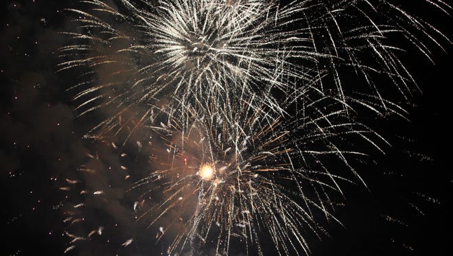 Fireworks explode over Williamsburg on July 4, 2017.