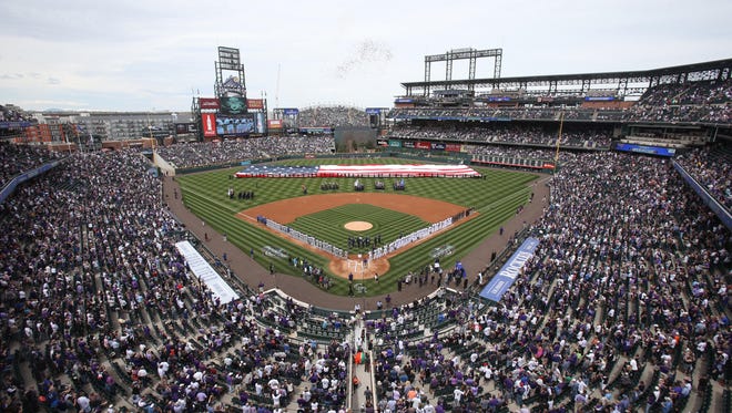 A packed house gets ready for the 2017 home opener at Coors Field last year. The Colorado Rockies take on the Atlanta Braves Friday in this year's opener.