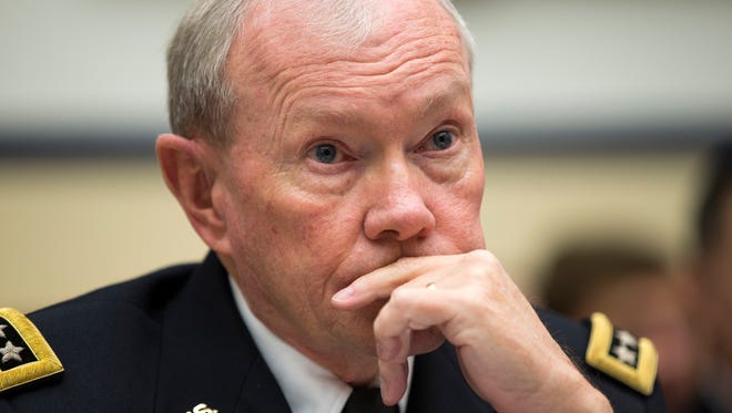 Joint Chiefs Chairman Gen. Martin Dempsey listens on Capitol Hill in Washington on Nov. 13, 2014, while testifying before the House Armed Services committee hearing on the Islamic State militant group.