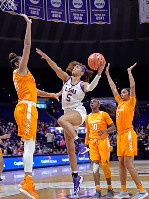 Tennessee defenders Mercedes Russell (21), Meme Jackson (10) and Evina Westbrook, shown surrounding LSU's Ayana Mitchell last month, ganged up on Florida Thursday night, holding the Gators to two points in the third quarter.