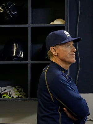 Milwaukee Brewers Manager Ron Roenicke watches the game against the Cincinnati Reds during the seventh inning of a baseball game Monday, April 20, 2015, in Milwaukee.