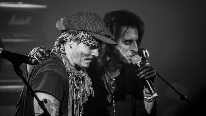 Hollywood Vampires perform during Alice Cooper Christmas Pudding at Celebrity Theatre on Dec. 3, 2016 in Phoenix. The band included Joe Perry of Aerosmith and actor Johnny Depp on guitar.