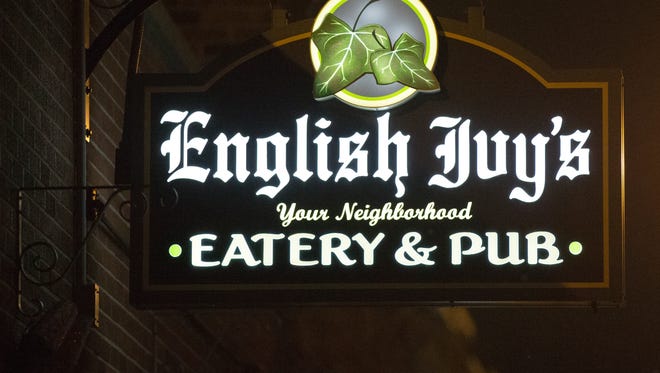 Signage outside English Ivy's, a club with a gay and straight clientele on the near northside of Indianapolis, Friday, December 9, 2016.