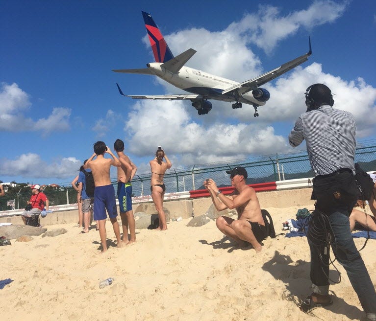 At Princess Juliana International Airport in St. Maarten, planes arrive right on top of sunbathers and snorkelers.