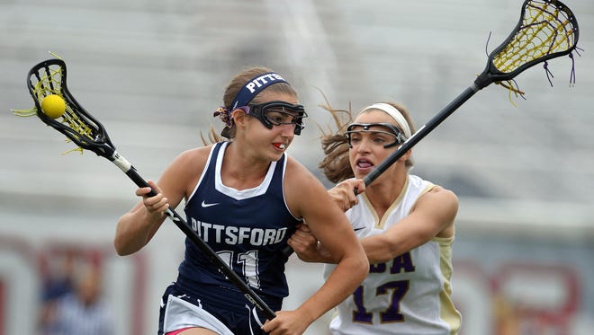 Pittsford's Elizabeth Blanding, left, is defended by CBA's Alexandra Fess during the NYSPHSAA 2016 State Girls Lacrosse Championships Class A final played at SUNY Cortland in Cortland, N.Y. on Saturday, June 11, 2016. Pittsford's season ended with an 11-6 loss to Christian Brothers Academy-III.