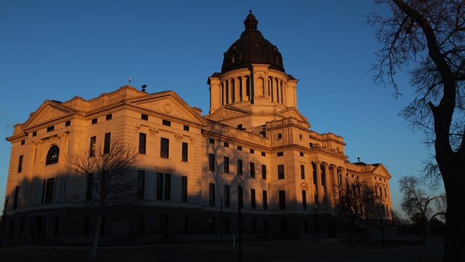 The setting sun paints the front side of the South Dakota State Capitol in Pierre on Tuesday, Feb. 23, 2016.