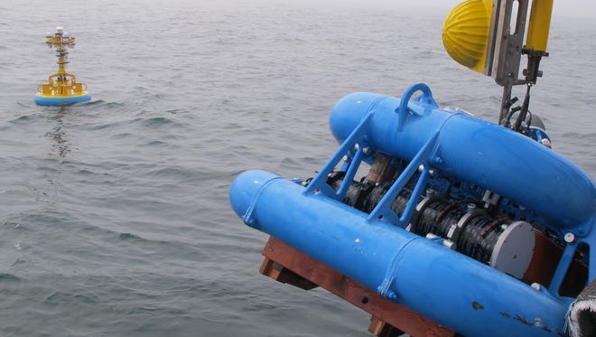 The Endurance Washington Inshore Surface Mooring, which contains seafloor and surface instruments and communications equipment, being deployed off Grays Harbor, Washington, in 2014.