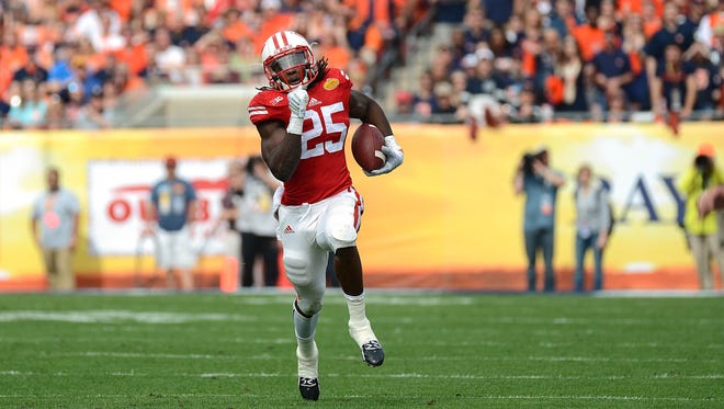 Jan 1, 2015: Wisconsin Badgers running back Melvin Gordon (25) runs the ball in the first half against the Auburn Tigers in the 2015 Outback Bowl at Raymond James Stadium. Wisconsin defeated Auburn 34-31 in overtime.