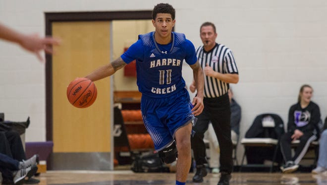 TraVon Johnson of Harper Creek brings the ball down court against Lakeview.