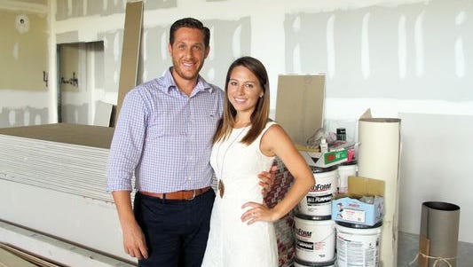 Brian and Nicole Roland stand in the space that will become Venue Naples.
